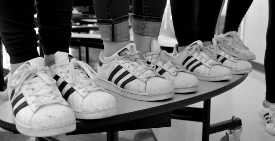 girls wearing adidas shoes