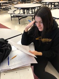 Junior Mia Servidio looks stressed out as she crams for midterms. 