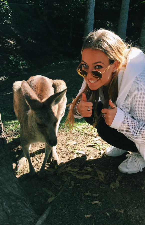 Senior Ally Schachtel posing with a kangaroo in Sydney, Australia