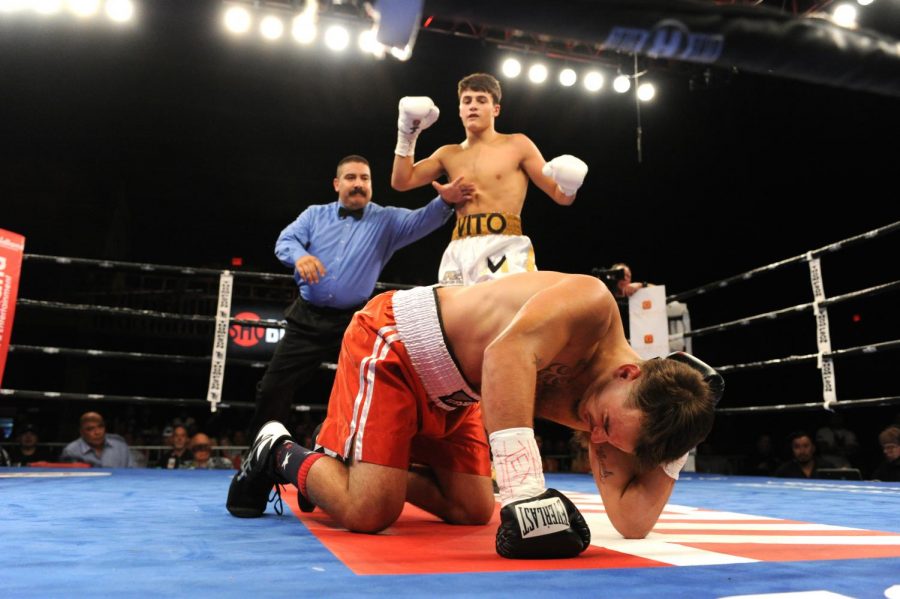 (Photo By: Emily Harney/Banner Promotions ©2019) Senior Vito Mielnicki pauses after knocking down his opponent in Midland, Texas, on Sept. 20.