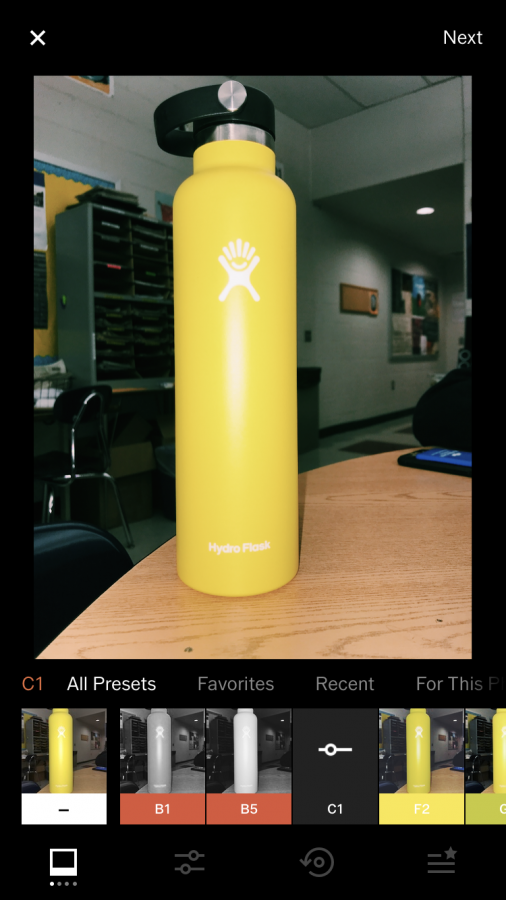 An artsy picture of a VSCO girls HydroFlask on her desk. This is of course edited with the popular C1 filter. 
