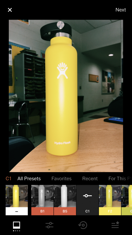 An+artsy+picture+of+a+VSCO+girls+HydroFlask+on+her+desk.+This+is+of+course+edited+with+the+popular+C1+filter.+