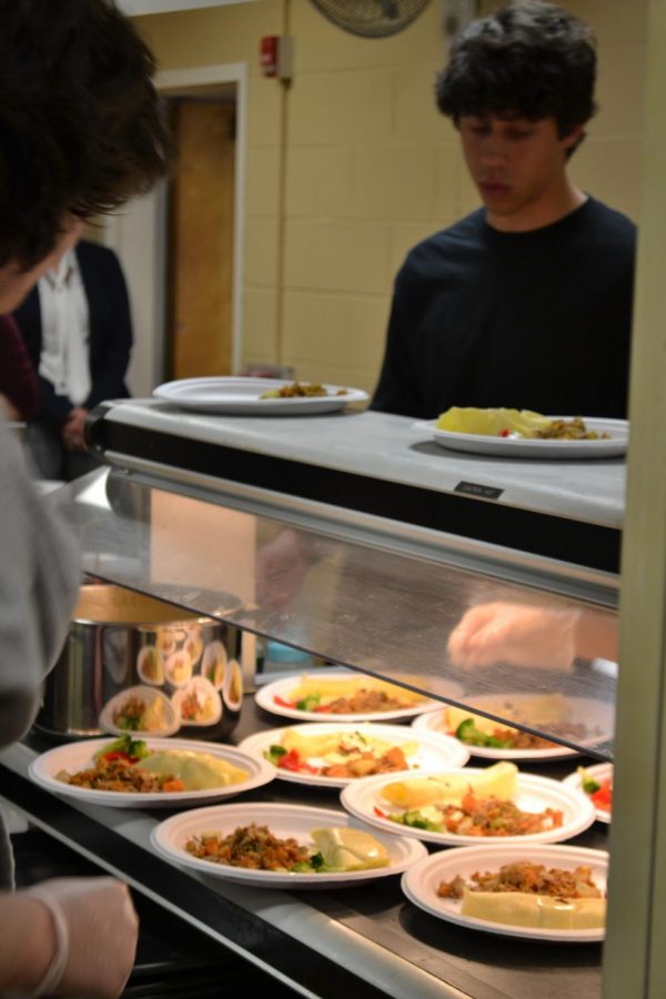 (Staff Photo) Culinary II students worked hard on providing senior citizens quality food. 