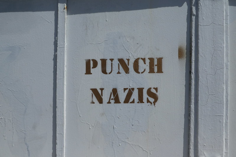 The phrase Punch Nazis has been elevated from counterprotest message to Internet meme, but how much do people actually mean what they say?