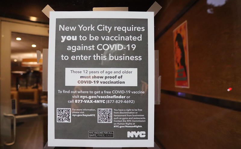 A diner in New York City displays information on the citys COVID-19 vaccine mandate in August 2021. Some people have argued in bad faith that safety restrictions barring people unvaccinated against COVID-19 from entering businesses is akin to Nazi Germany tactics employed against the Jews during World War II. 