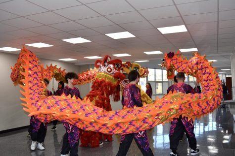 Members of the Chinese Club dance with lion and dragon decorations as part of the Chinese New Year parade Feb. 9.