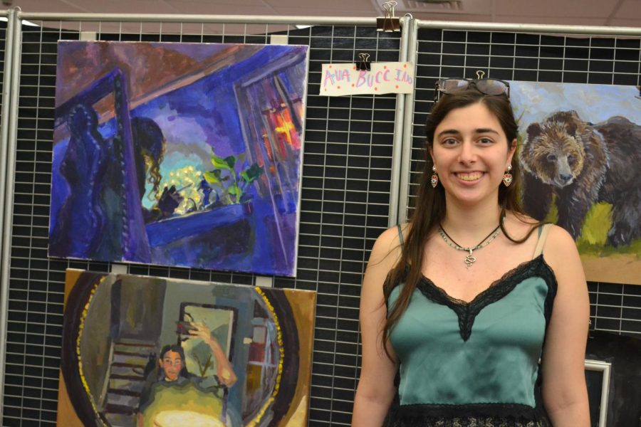 Teachers and students attend the art show on May 19 and admire the various artwork pieces.