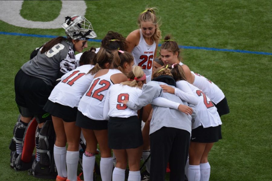 The field hockey Knights in a huddle during their thrilling win over rival Oak Knoll on Oct. 3. 