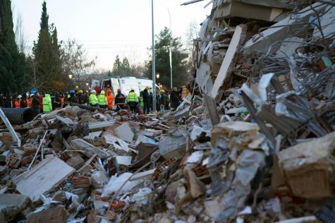 Homes are destroyed, and rescue workers search through piles of rubble in their attempts to find as many survivors as possible.
