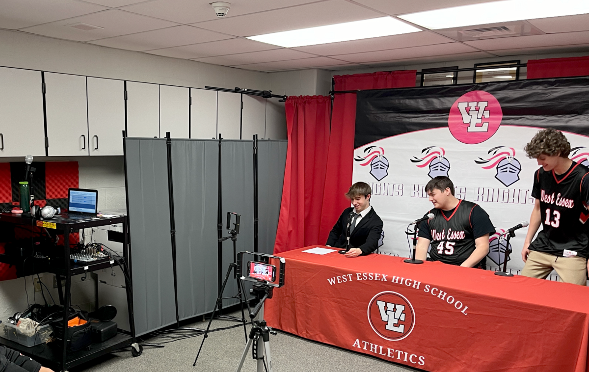 Managing Editor JJ Bella and staff from the Wire prepare for a press conference for Winter Varsity Media Day.