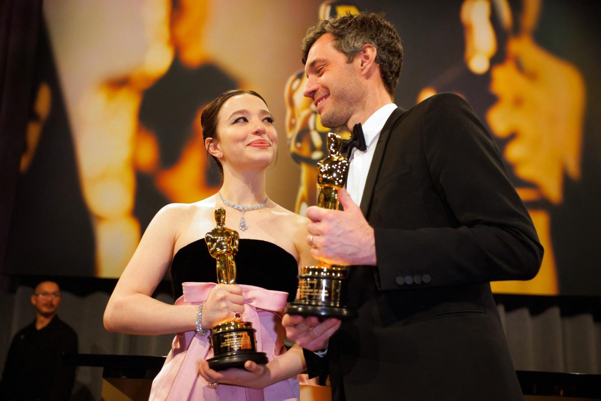 Mikey Madison holds the Oscar for the Best Actress for "Anora" and  producer Alex Coco  pose with the Oscar for Best Picture for "Anora" at the Governors Ball following the Oscars show at the 97th Academy Awards in Hollywood, Los Angeles, California, U.S., March 2, 2025. REUTERS/Mike Blake