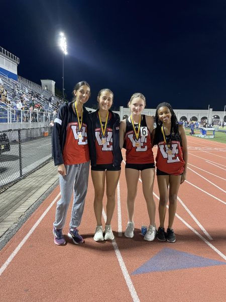 Spango (third to the left) posed with her 4x400 team at the sectional championship on May 2.