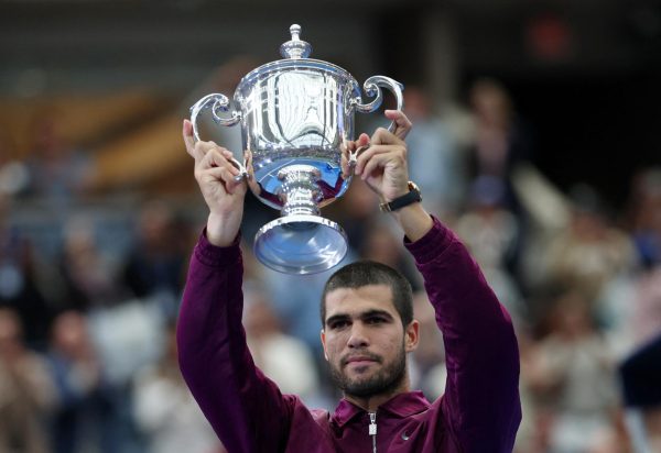 Tennis - U.S. Open - Flushing Meadows, New York, United States - September 7, 2025 Spain's Carlos Alcaraz celebrates with the trophy after winning the men's singles final REUTERS/Mike Segar
