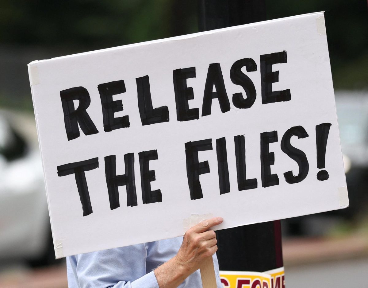A protester calling for the release of the Epstein files holds a sign in Washington, D.C., on Aug. 6. 