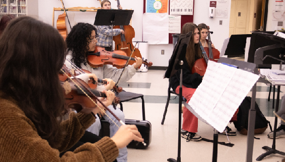 An orchestra class works on performing in unison, building teamwork and fostering collaboration.                                                                        