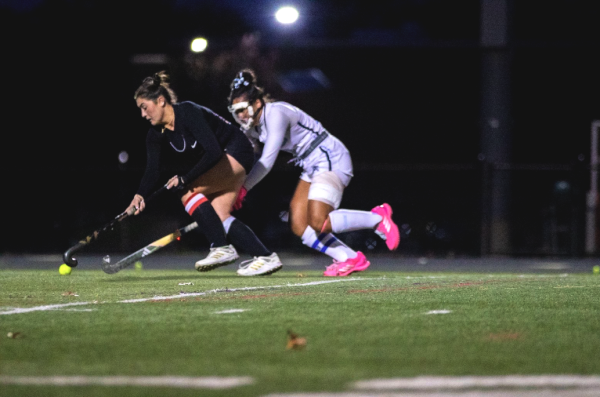 Minnella (in black) takes on West Morris Central during a regular season game.