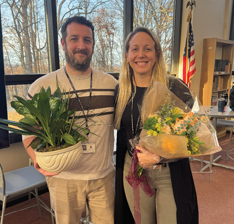 Patrick McGlynn and Kimberly Greulich stand together after receiving their awards at a faculty meeting on Nov. 26. 