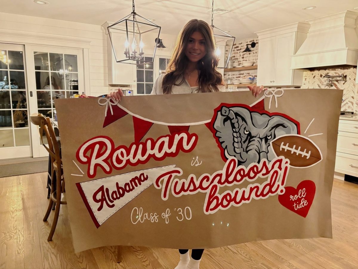 Senior LeeAna embraces her creative side through painting banners for special events. 
