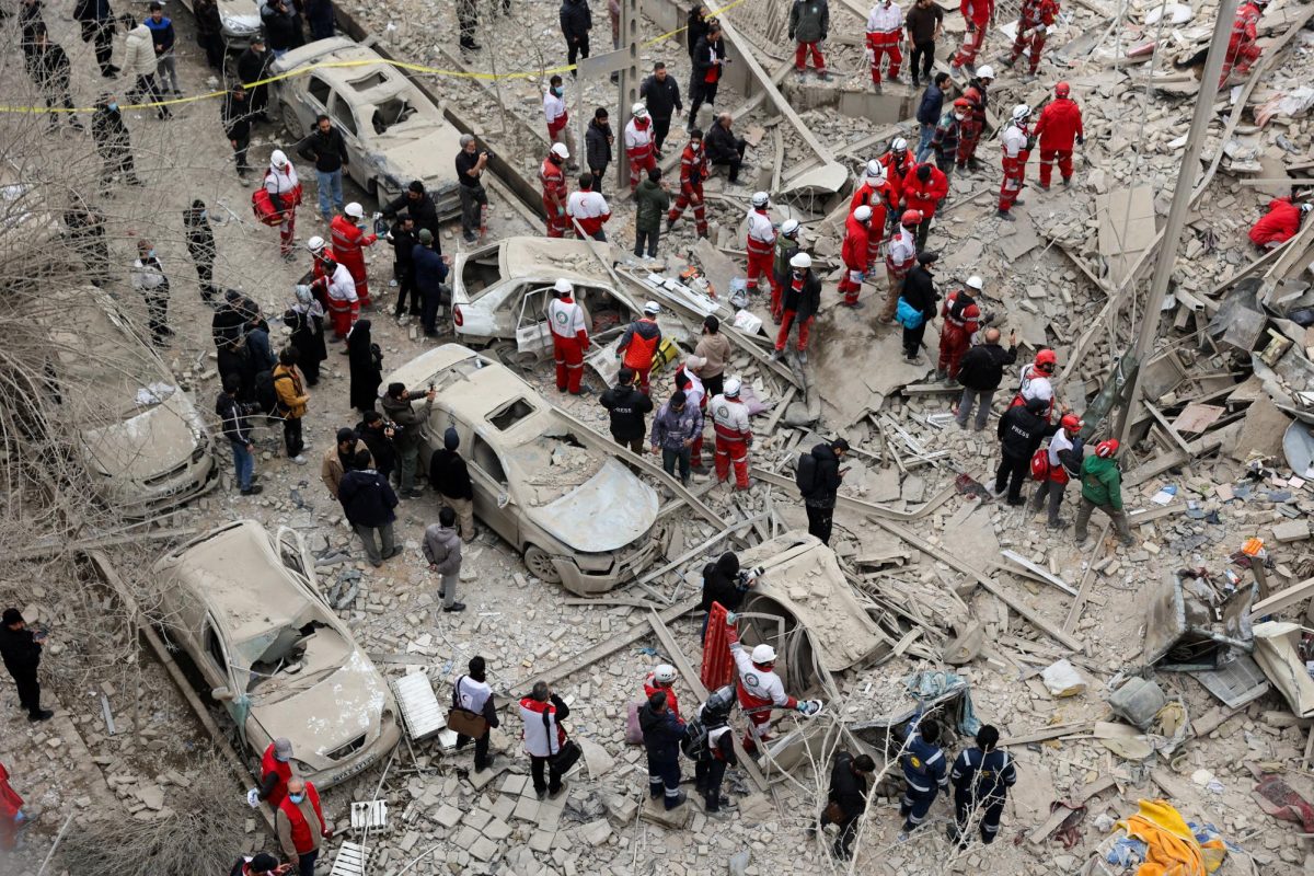 Emergency personnel work at the site of a strike on a residential building, amid the U.S.-Israeli conflict with Iran, in Tehran, Iran, March 16, 2026. 