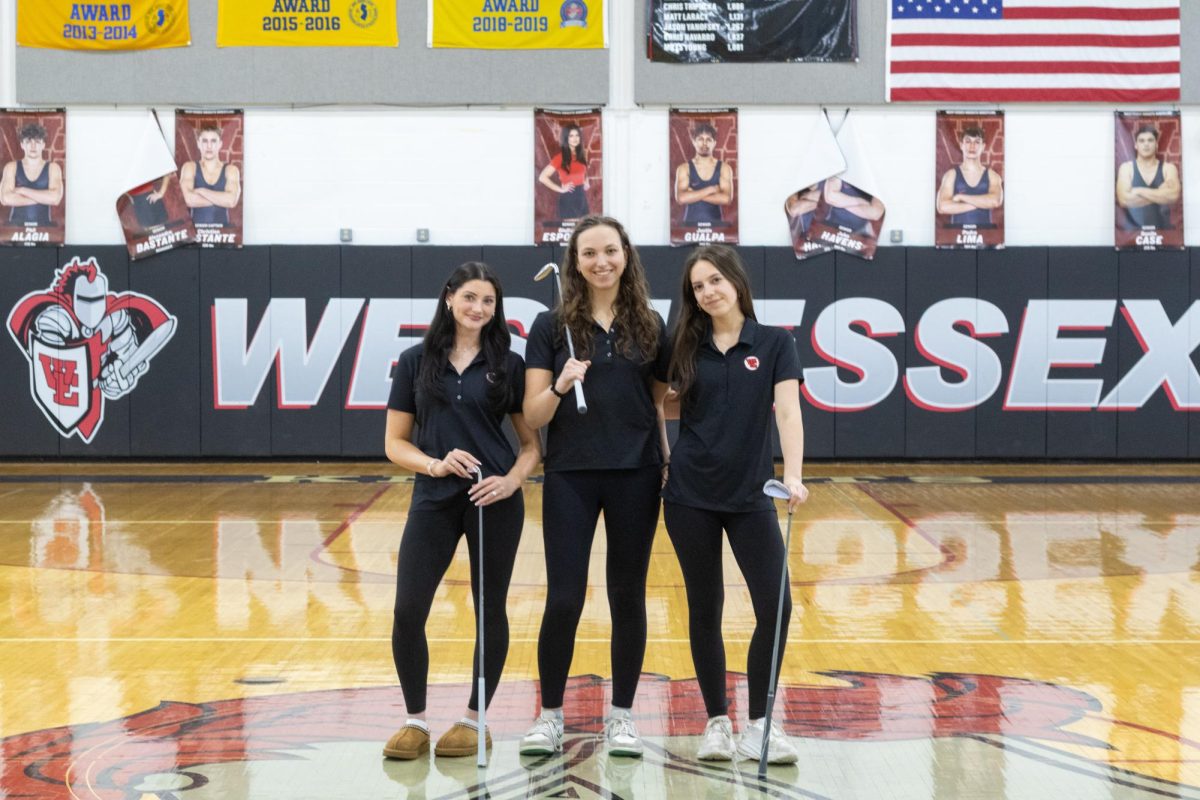The girls' golf team, led by junior captains (from left) Nicole Manos, Marley Caplan and Ella Afanador, hope to continue to expand the program. 